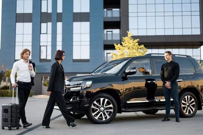 a group of people walking next to a suv
